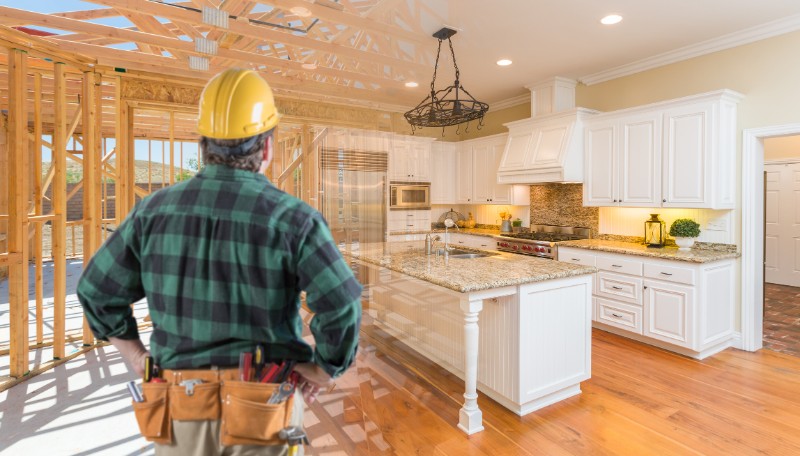 Contractor Standing In Front Custom Kitchen