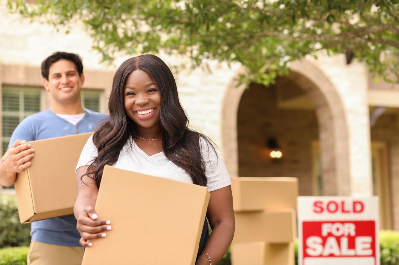 couple moves boxes